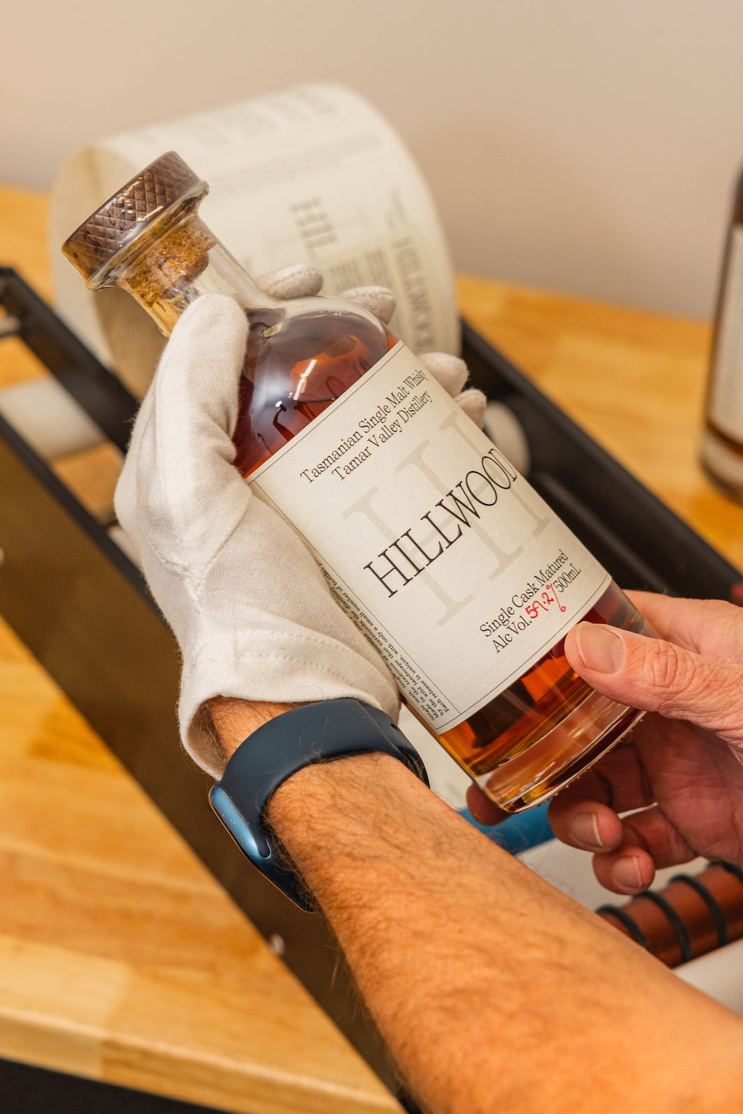 Ollie admiring the newly hand labelled bottle of Single Malt Whisky.