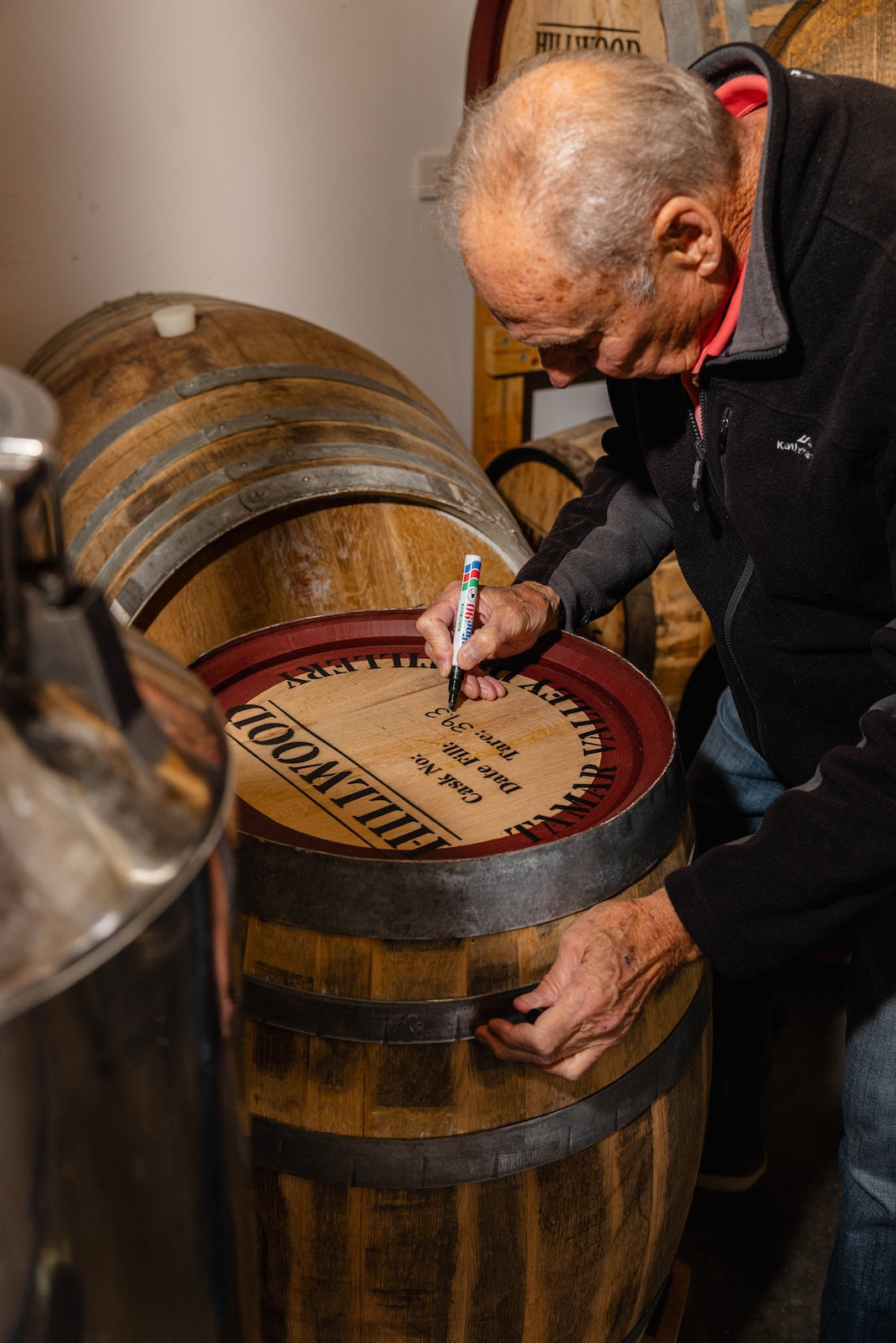 Paul writing by hand the notes of the Single Malt Whisky on the handmade single malt whisky cask.