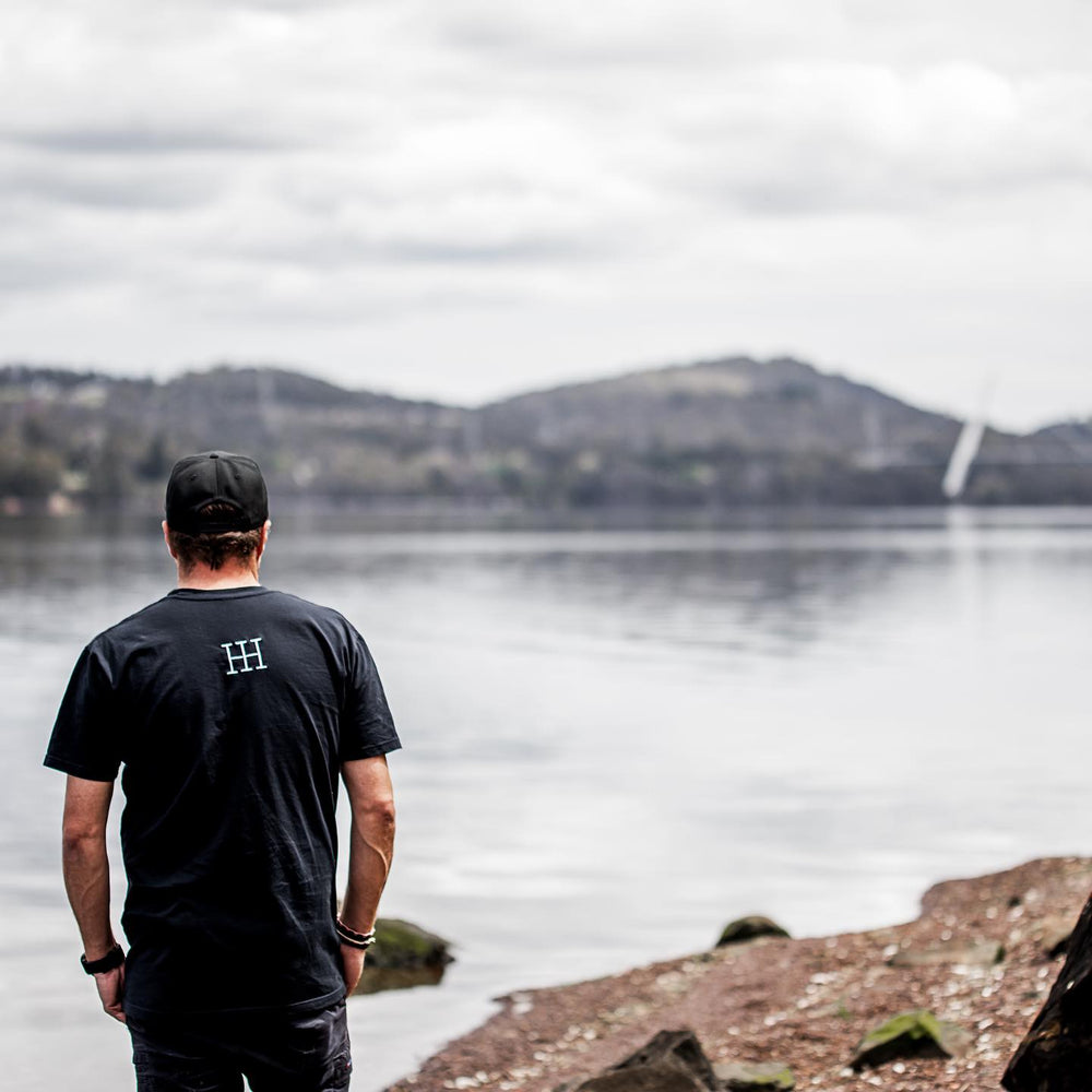 Ollie looking out over the Tamar River from the edge of the Tamar Valley next to Tamar Valley Distillery