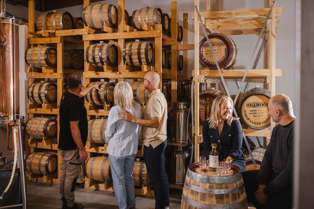 Ollie showing distillery visitors the hand made single malt whisky casks at Hillwood Distillery.