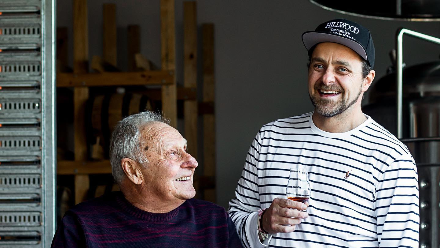 Hillwood Whisky head distiller Paul, and manager Ollie (father and son) sharing a dram of Hillwood Whisky together outside the distillery.